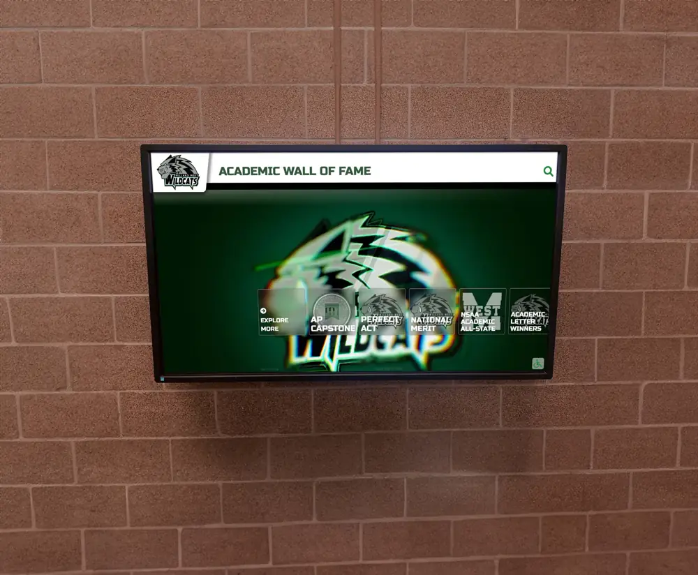 A wall-mounted touchscreen showing an Academic Wall of Fame