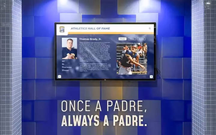 A Hall of Fame touchscreen in a blue tiled alcove