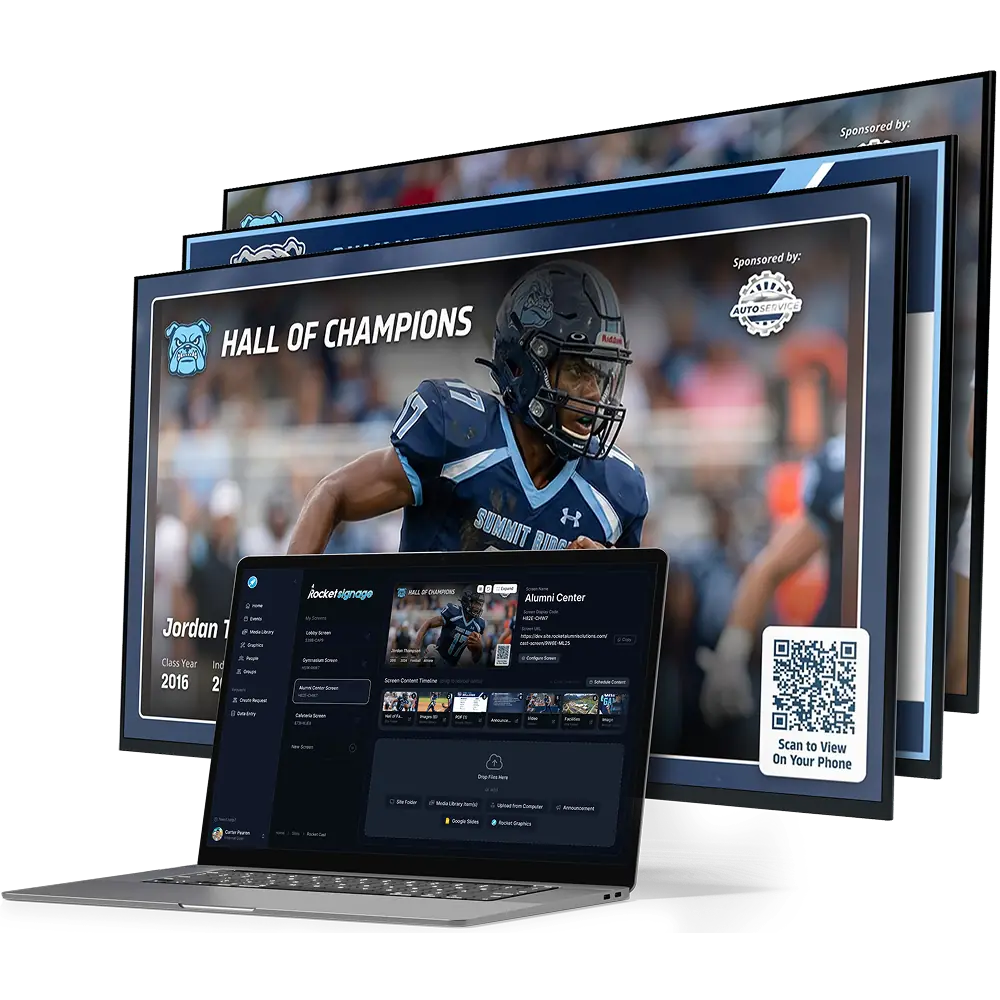 School screens showing a Hall of Champions slide, in front of a laptop running the signage editor
